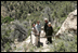 Mrs. Laura Bush pauses for a photo while hiking in Mesa Verde National Park in Colorado with, from left, Lynn Scarlett, Acting Secretary of the U.S. Department of Interior, Fran Mainella, Director, National Park Service and Larry Wiese, Superintendent of Mesa Verde National Park on Tuesday, May 23, 2006. Mesa Verde, founded as a national park on June 29, 1906, is celebrating its Centennial Anniversary this year. White House photo by Shealah Craighead 