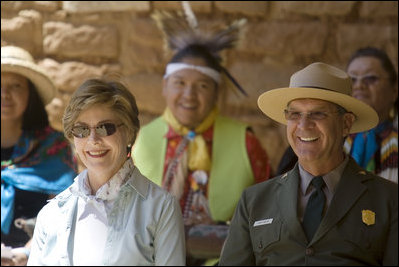 Mrs. Laura Bush and Mesa Verde National Park Superintendent Larry Wiese share a laugh, Thursday, May 23, 2006, during the celebration of the 100th anniversary of Mesa Verde and the Antiquities Act in Mesa Verde, Colorado. Also pictured are members of the Ute Mountain Ute Tribe. White House photo by Shealah Craighead 