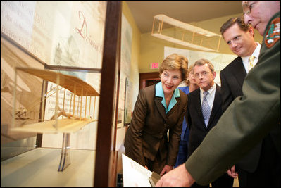 Mrs. Laura Bush, U.S.Senator. Mike DeWine, and U.S.Rep. Mike Turner listen to National Park Ranger Larry Blake as he shows them a model of the Wright Brothers airplane during a tour of the Dayton Aviation Heritage National Historical Park in the Wright-Dunbar Village, a Preserve America neighborhood, in Dayton, Ohio, Wednesday, August 16, 2006. Also shown is Fran DeWine, wife of Sen. Mike DeWine. White House photo by Shealah Craighead 