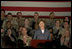Mrs. Laura Bush addresses American troops Thursday, Oct. 25, 2007, at Ali Al Salem Air Base near Kuwait City. "With your courage and compassion, you show that the United States military is one of the greatest forces for good in the world," Mrs. Bush told the troops. "And I hope you know that we pray... for an end to the violence everywhere so that future generations can grow up in a world at peace -- a world that you shaped."