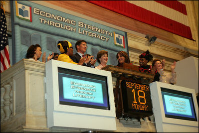 Mrs. Laura Bush is applauded as she stands over the New York Stock Exchange Monday, Sept. 18, 2006, where she visited to highlight literacy's role in extending the benefits of free enterprise to individuals around the world. White House photo by Shealah Craighead 