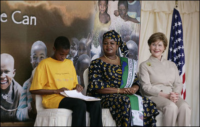 Mrs. Laura Bush and Mrs. Salma Kikwete, First Lady of Tanzania, enjoy Salvation Army Children as they perform on stage Sunday, Feb. 17, 2008, at the WAMA Foundation in Dar es Salaam. The foundation, founded by Mrs. Kikwete, is a non-profit organization focusing on development by improving women’s social and economic status by redefining gender roles and creating more opportunities for the development of women and children.