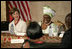 Mrs. Laura Bush participates in a roundtable discussion Thursday, February 21, 2008, in Monrovia, Liberia, with Karyumu Boakai, Spouse of Vice President Joseph Boakai, and local adults who have been faced with and persevered in working with Liberian youth who have been affected by the war.