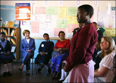 Mrs. Laura Bush and Ms. Jenna Bush meet with the educators and students at Regiment Basic School Thursday, June 28, 2007, in Lusaka, Zambia. Of the 1,200 students at the school, 300 are orphans. After meeting with students and watching skits and song performances, Mrs. Bush addressed the press saying, “I just met with a group of girls who are receiving scholarships, some of them are orphan girls, orphans because their parents died of AIDS, and they’re receiving scholarships from PEPFAR, the President’s Emergency Plan for AIDS relief.” 