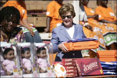 Mrs. Laura Bush assembles a home care kit at the Mututa Memorial Center Thursday, June 28, 2007, in Lusaka, Zambia. The center provides many humanitarian services including home-based care for people living with HIV/AIDS, care for orphans and promotes abstinence and faith for youth. It serves more than 150 individuals with a core of 36 trained caregivers.