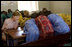 Mrs. Laura Bush and Ms. Jenna Bush visit with students at the Nelson Mandela Primary School Complex Friday, June 29, 2007, in Bamako, Mali. The teachers at this school participate in the Teacher Training via Radio Project, a live radio broadcast to train teachers and benefit with active learning. The President’s Africa Education Initiative is working with the Malian Ministry of Education to fund the program.