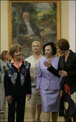 Mrs. Laura Bush and Slovenia's First Lady Barbara Miklic Turk listen as Dr. Barbara Jaki, right, conducts a tour of the National Gallery of Slovenia Tuesday, June 10, 2008 in Ljubljana, Slovenia.