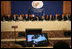 Mrs.Laura Bush gives remarks at the U.S.-Afghan Donor's Conference as visuals of her recent trip to Afghanistan play on the monitors set up for the representatives from around the world. Leaders from Afghanistan and Albania flank Mrs. Bush at the June 12, 2008 gathering at the Centre de Conferences Internationals in Paris.