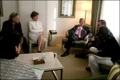 President George W. Bush and Mrs. Laura Bush participates in discussion with Irish rocker Bono, Sir Bob Geldof, left, and Senegalese singer Youssou N'Dour Wednesday, June 6, 2007, at the Kempinski Grand Hotel in Heiligendamm, Germany, site of the 2007 G8 Summit.