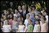 President George W. Bush and Mrs. Laura Bush pose for a photo Saturday, June 9, 2007, with children of employees and staff of the American Embassy in Rome.