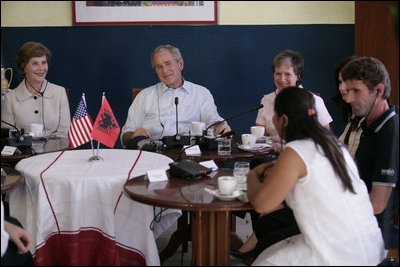 President George W. Bush and Mrs. Laura Bush participate in a roundtable discussion at Cafe Cela in Fusche Kruje, Albania, Sunday, June 10, 2007, on the USAID Micro-Lending Program. Said the President, "Laura and I thank the Mayor, we thank the owner of the restaurant, and we thank these entrepreneurs for joining us to talk about your story, about your dreams, and about the opportunities a micro-loan program, provided by the taxpayers of the United States, is giving you to create jobs."