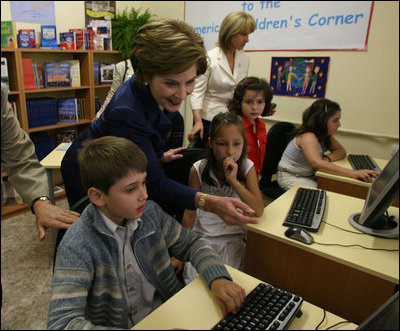 Mrs. Laura Bush joins youngsters at the opening of the American Children's Corner at Sofia City Library Monday, June 11, 2007, in Sofia. Mrs. Bush said, "The books in this American Corner tell the story of the United States, describing my country's history, culture and diverse society. In these books, children in Sofia can discover literature that children in the United States enjoy."
