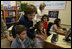 Mrs. Laura Bush joins youngsters at the opening of the American Children's Corner at Sofia City Library Monday, June 11, 2007, in Sofia. Mrs. Bush said, "The books in this American Corner tell the story of the United States, describing my country's history, culture and diverse society. In these books, children in Sofia can discover literature that children in the United States enjoy."