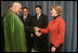 Mrs. Laura Bush greets Afghanistan President Hamid Karzai at the Headquarters of the Romanian Intelligence Service Thursday, April 3, 2008, where they participated in the Young Atlanticist Summit Video Conference with Kabul University.