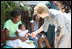 Mrs. Laura Bush is introduced to a participant and her infant daughter at the GHESKIO HIV/AIDS Center’s women’s clinic, Thursday, March 13, 2008, in Port-au-Prince, Haiti. The program was initiated to help improve the lives of HIV patients.