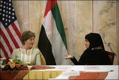 Mrs. Laura Bush talks with Basmah Zeyoudi during a roundtable discussion with young Arab women leaders Monday, Oct. 22, 2007, in Abu Dhabi, United Arab Emirates. Moderating the discussion is U.S. Ambassador Michele Sison.