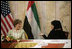 Mrs. Laura Bush talks with Basmah Zeyoudi during a roundtable discussion with young Arab women leaders Monday, Oct. 22, 2007, in Abu Dhabi, United Arab Emirates. Moderating the discussion is U.S. Ambassador Michele Sison.