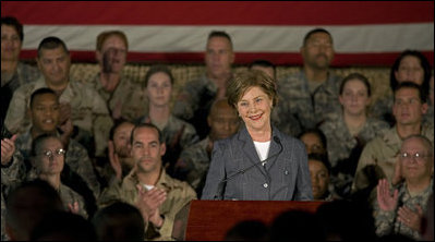 Mrs. Laura Bush addresses American troops Thursday, Oct. 25, 2007, at Ali Al Salem Air Base near Kuwait City. "With your courage and compassion, you show that the United States military is one of the greatest forces for good in the world," Mrs. Bush told the troops. "And I hope you know that we pray... for an end to the violence everywhere so that future generations can grow up in a world at peace -- a world that you shaped."