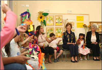 Mrs. Laura Bush joins students at Hand in Hand School for Jewish-Arab Education Wednesday, May 14, 2008, during her visit to Jerusalem. Joining her on the tour of the school that provides integrated, bilingual education to Jewish and Arab students in Israel is Mrs. Aliza Olmert, spouse of Israeli Prime Minister Ehud Olmert. 