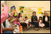 Mrs. Laura Bush joins students at Hand in Hand School for Jewish-Arab Education Wednesday, May 14, 2008, during her visit to Jerusalem. Joining her on the tour of the school that provides integrated, bilingual education to Jewish and Arab students in Israel is Mrs. Aliza Olmert, spouse of Israeli Prime Minister Ehud Olmert. 