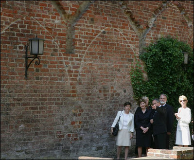 Mrs. Laura Bush is escorted on a tour outside the City of Stralsund Archives in Stralsund, Germany, Thursday, July 13, 2006, by Dr. Hans-Joachim Hacker, director of the City of Stralsund Archives.