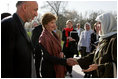 Afghan President Hamid Karzai introduces his wife, Dr. Karzai, to Laura Bush outside the presidential residence in Kabul, Afghanistan, Wednesday, March 30, 2005.