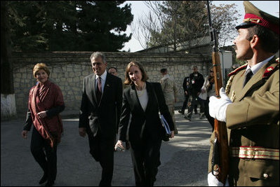 Laura Bush arrives at the Presidential Palace accompanied by U.S. Ambassador to Afghanistan Zalmay Khalilzad and Under Secretary of State for Global Affairs Paula Dobriansky in Kabul, Afghanistan Wednesday, March 30, 2005. 