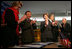 Laura Bush applauds as Secretary of Education Margaret Spellings and Afghan Minister of Education Noor Mohammas Qarqeen complete the signing of the Memorandum of Understanding for funds to build a university in Kabul, Afghanistan, Wednesday, March 30, 2005. 