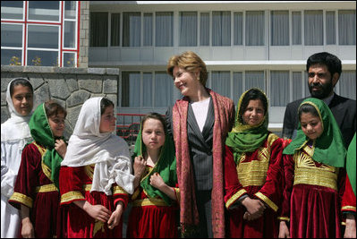 Mrs. Bush stands with a group of Afghan girls upon her arrival in Kabul, Afghanistan, Tuesday, March 29, 2005. 
