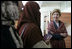 Laura Bush talks with female students in the newly built National Women’s Dormitory on the campus of Kabul University Wednesday, March 30, 2005, in Kabul, Afghanistan. The women’s dormitory was built to provide a safe place for young women to live while pursuing studies away from their families. 