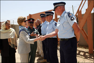 Mrs. Laura Bush greets New Zealand Police officers Sunday, June 8, 2008, during her visit to the Police Training Academy in Bamiyan, Afghanistan. Mrs. Bush traveled to Afghanistan to highlight the continued U.S. commitment to the country and its President Hamid Karzai.