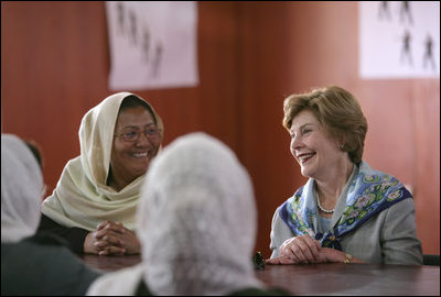Mrs. Laura Bush smiles as she meets Sunday, June 8, 2008, with female graduates of the Police Training Academy in Bamiyan province in Afghanistan. With her is Bamiyan Governor Habiba Sarabi.