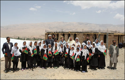 Mrs. Laura Bush is joined by Habiba Sarabi, Governor of Bamiran Province, right, and students of the Ayenda Learning Center Sunday, June 8, 2008, during a tour of the school's construction site in Bamiyan, Afghanistan.