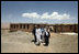 Mrs. Laura Bush is joined by Governor of Bamiran Province, Habiba Sarabi, right, and students, during a tour of the future site of the Ayenda Learning Center Sunday, June 8, 2008, in Bamiyan, Afghanistan.The tour was led by Ihsan Ullah Bayat, far left. Once completed, the Ayenda Learning Center will provide a safe and nurturing environment for 128 of Bamiyan most disadvantaged children to live. At the same time, it will provide educational opportunities for as many as 210 children in the region.