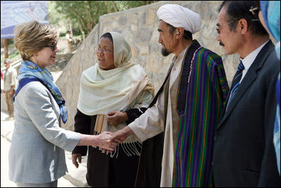 Mrs. Laura Bush meets with local leaders as she arrives June 9, 2008 at the Bamiyan Bazaar in Afghanistan to inaugerate work on the road project.