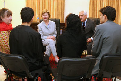 Mrs. Laura Bush is joined by Afghan Foreign Minister Rangeen Dadfar Spanta, center right, for a meeting with Afghan teachers and students, Sunday, June 8, 2008, during an unannounced visit to Kabul. Attending the meeting were representatives from Kabul University, American University of Afghanistan, International School of Kabul and the Women's Teacher Training Institute.