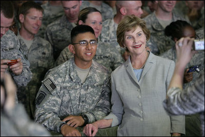 Mrs. Laura Bush poses for a photo with a US soldier during her visit to Bagram Air Force Base Sunday, June 8, 2008, in Bagram, Afghanistan.