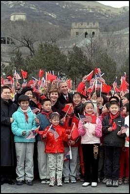 The President and Mrs. Bush pose with a group of Chinese children at the Great Wall of China in Badaling about an hour outside of Beijing, Friday, February 22, 2002. The children waved flags and sang for the Bushes.