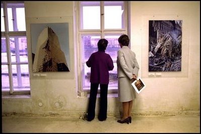 Laura Bush and Meda Mladek look over the rushing waters of the Vlatva River from an exhibit in Mladek's museum in Prague Thursday, November 21, 2002.The museum, known as the Kampa Museum, was severly damaged by flooding in August. The collection features artists who worked under the Soviet occupied government. A special exhibit on Sept. 11, 2001, sponsored by the U.S. Embassy, was on display in the flood-ravaged rooms of the museum.