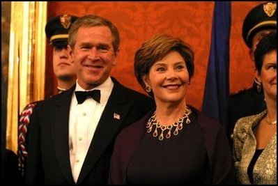 President George W. Bush and Laura Bush attend a dinner for NATO leaders hosted by the Czech Republic at Prague Castle in Prague, Czech Republic Wednesday, Nov. 20, 2002.