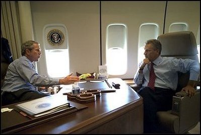 En route to Michigan, President Bush and President Kwasniewski talk on Air Force One. In addition to a private meeting in the President Bush's office, the Polish head of state was treated to a personally-guided tour the famous plane July 18. 