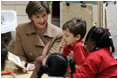 Laura Bush reads with children Wednesday, Jan. 26, 2006 during a visit to the kindergarten class at the Alice M. Harte Elementary School in New Orleans, La.
