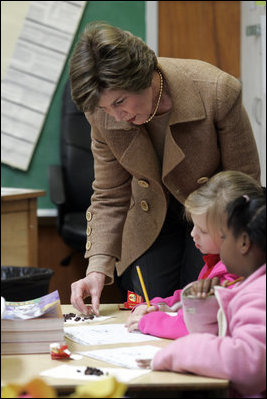 Laura Bush works with children Wednesday, Jan. 26, 2006 during a visit to the kindergarten class at the Alice M. Harte Elementary School in New Orleans, La.