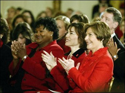 Laura Bush sits with Department of Health and Human Services Acting Assistant Secretary for Health Dr. Cristina Beato, center, and heart attack survivor Joyce Cullen, left, during White House ceremonies to launch American Heart Monday, Monday, Feb. 2, 2004. 