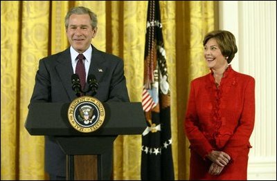 President George W. Bush and Laura Bush talk about heart disease as the number-one killer of all Americans during White House ceremonies to launch American Heart Month Monday, Feb. 2, 2003. The event, part of the national Heart Truth Campaign, was held to highlight the issue of heart disease and women.