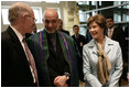 Mrs. Laura Bush and U.S Ambassador to Afghanistan Ronald E. Neumann speak with Afghanistan President Hamid Karzai, Wednesday, March 1, 2006, during the official dedication of the new U.S. Embassy building in Kabul, Afghanistan.
