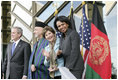 President George W. Bush stands with President Hamid Karzai of Afghanistan, Mrs. Laura Bush and Secretary of State Condoleezza Rice during welcoming ceremonies Wednesday, March 1, 2006, in Kabul.