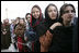 Women stand outside the U.S. Embassy in Kabul, Afghanistan Wednesday, March 1, 2006. President George W. Bush and Laura Bush made a surprise visit to the city and presided over a ceremonial ribbon-cutting at the embassy before continuing their trip to India.
