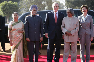 President George W. Bush and Laura Bush are greeted upon their arrival at Rashtrapati Bhavan, New Delhi, India, by India President A.P.J. Abdul Kalam; Prime Minister Manmohan Singh and his wife, Gursharan Kaur.
