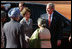 President George W. Bush and Laura Bush are greeted upon their arrival at Rashtrapati Bhavan, New Delhi, India, by India Prime Minister Manmohan Singh and wife, Gursharan Kaur.